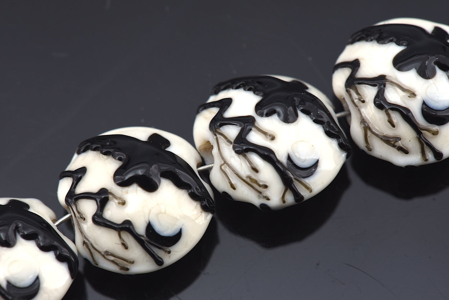 10306412 - Four Flying Raven Lentil Beads